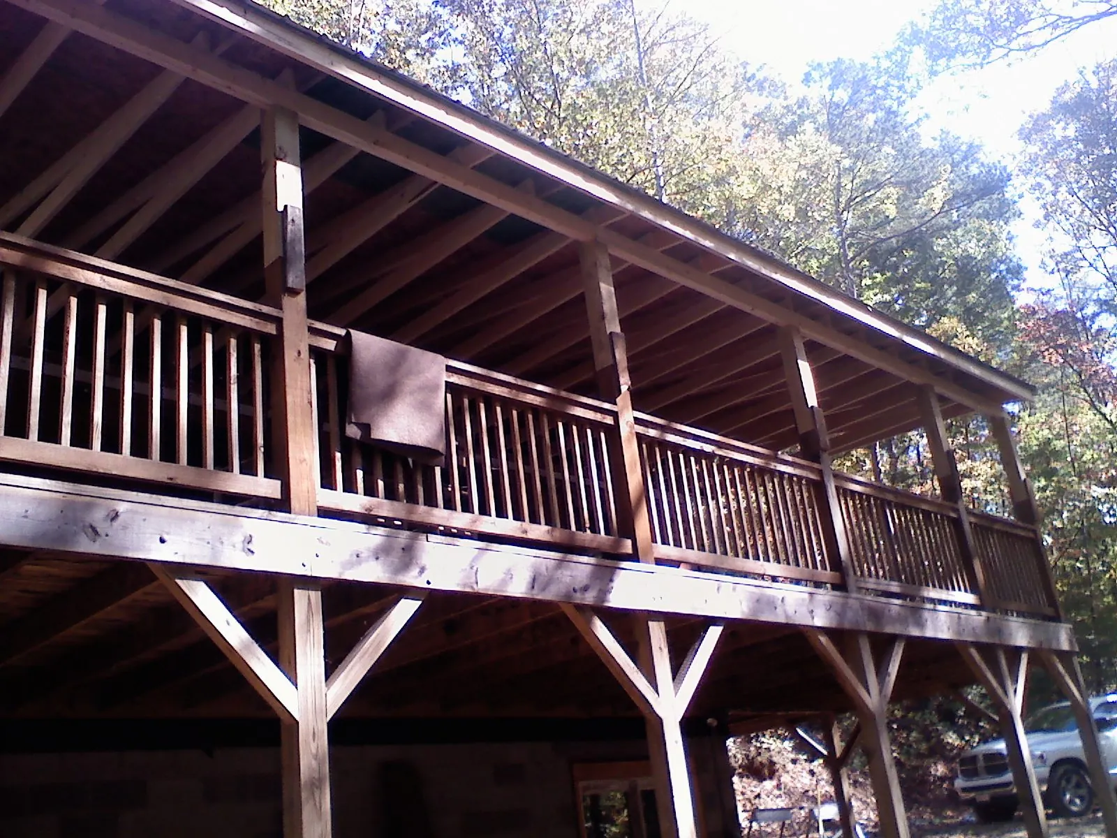 Timber framing under a new elevated porch and deck — Roof Leak Repair in North Rose by Roofing Brothers